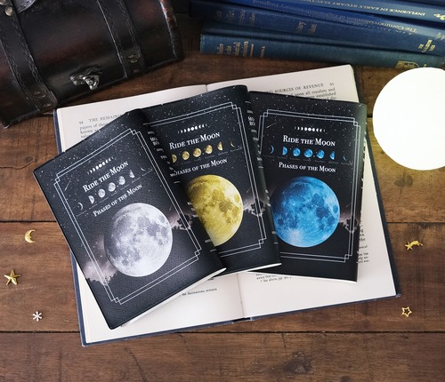 月の事柄が描かれた本のようなブックカバー "RIDE THE MOON" ・手帳カバー