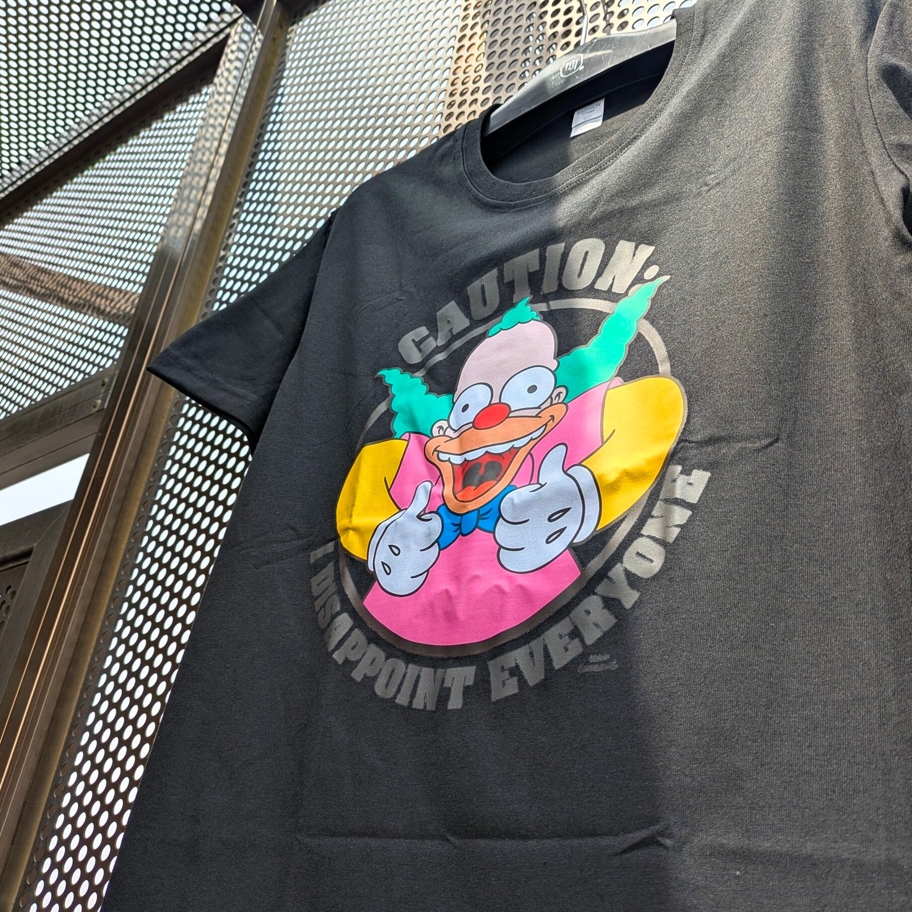 【 The Simpsons（ ザ・シンプソンズ ) 】『 CAUTION: I DISAPPOINT EVERYONE 』クラスティ・ザ・クラウン / Tシャツ〚アメリカン雑貨 アメトイ〛
