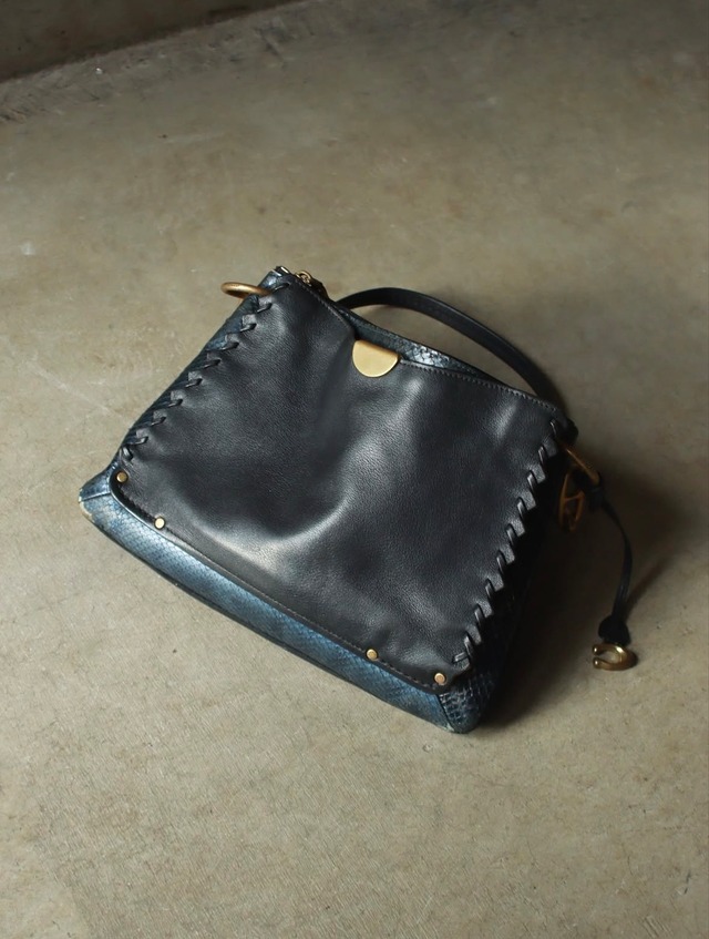 as is coach python leather hand bad .
