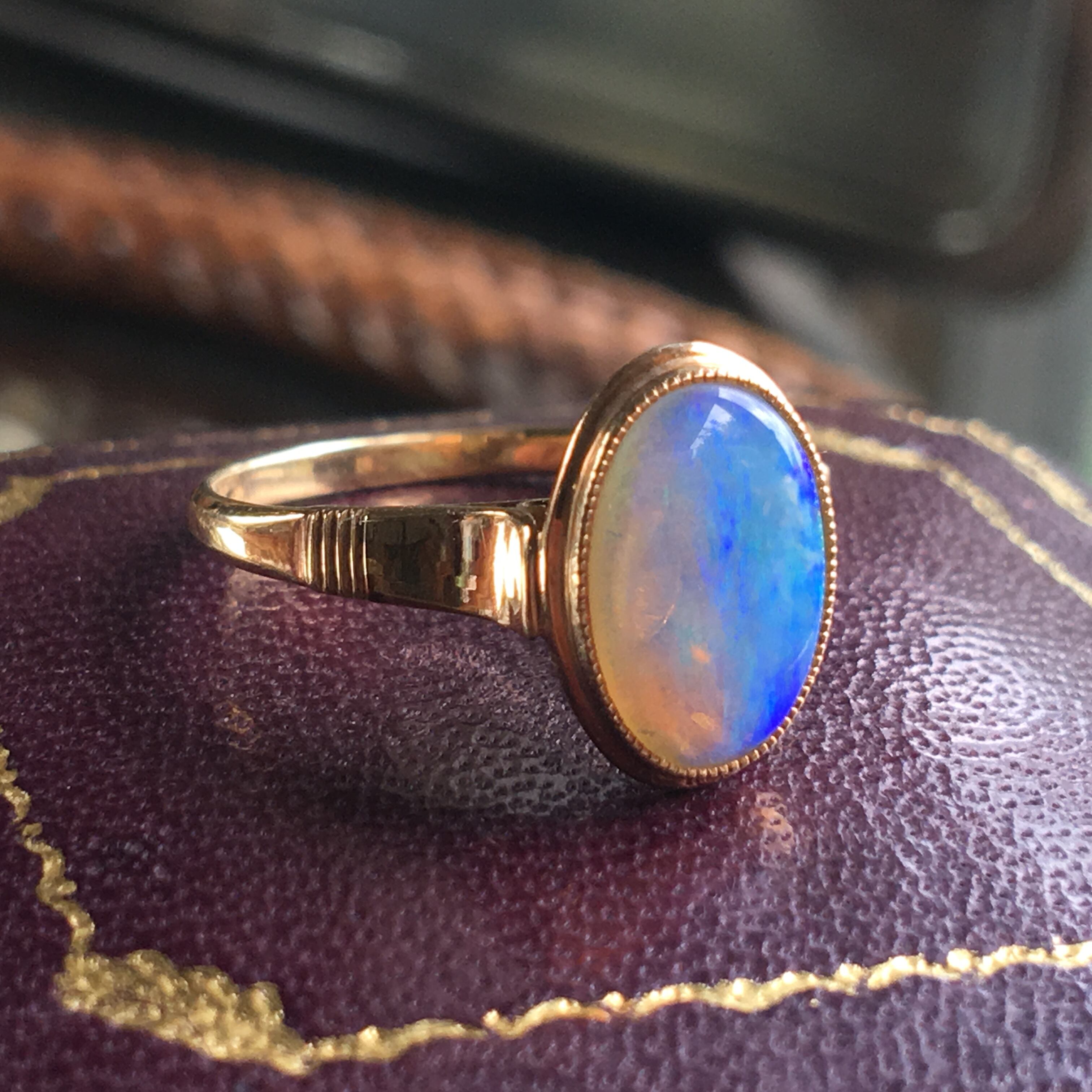 ヴィンテージ K18 光彩オパール覆輪留めリング