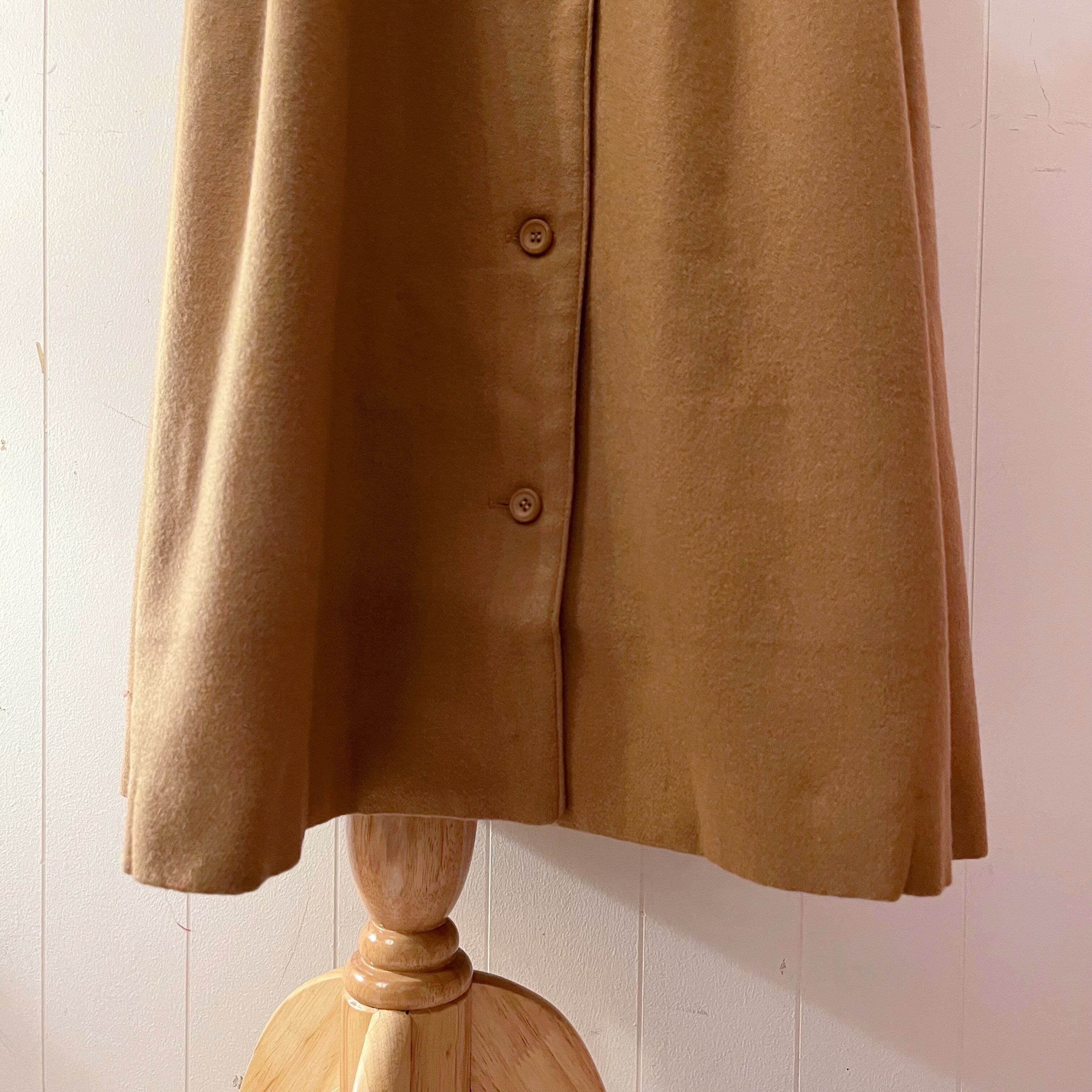 beige front button suspender skirt