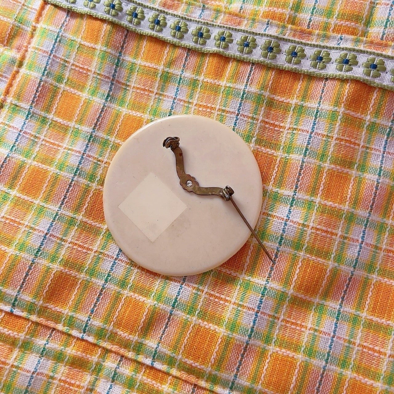 yellow floral round brooch
