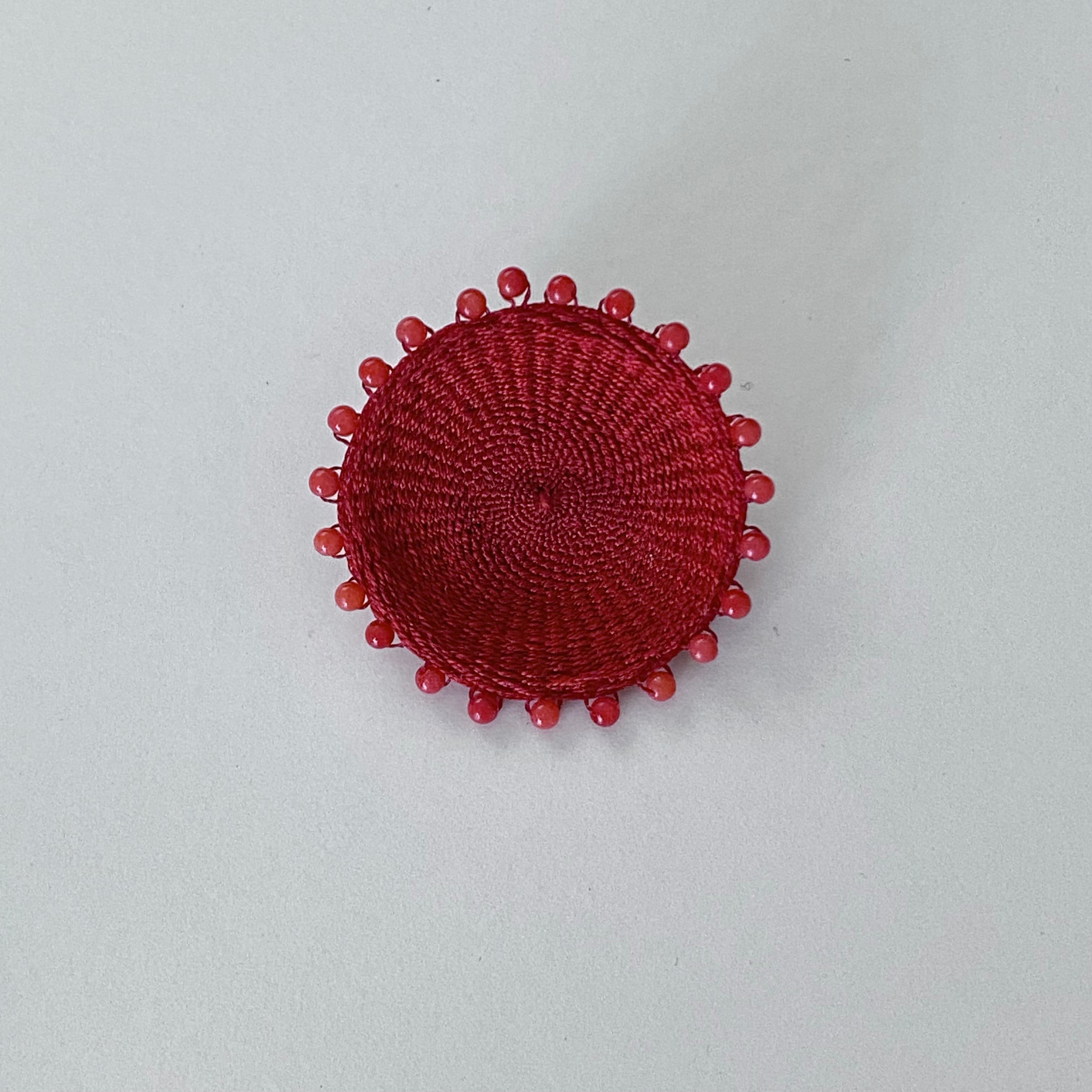 round brooch red