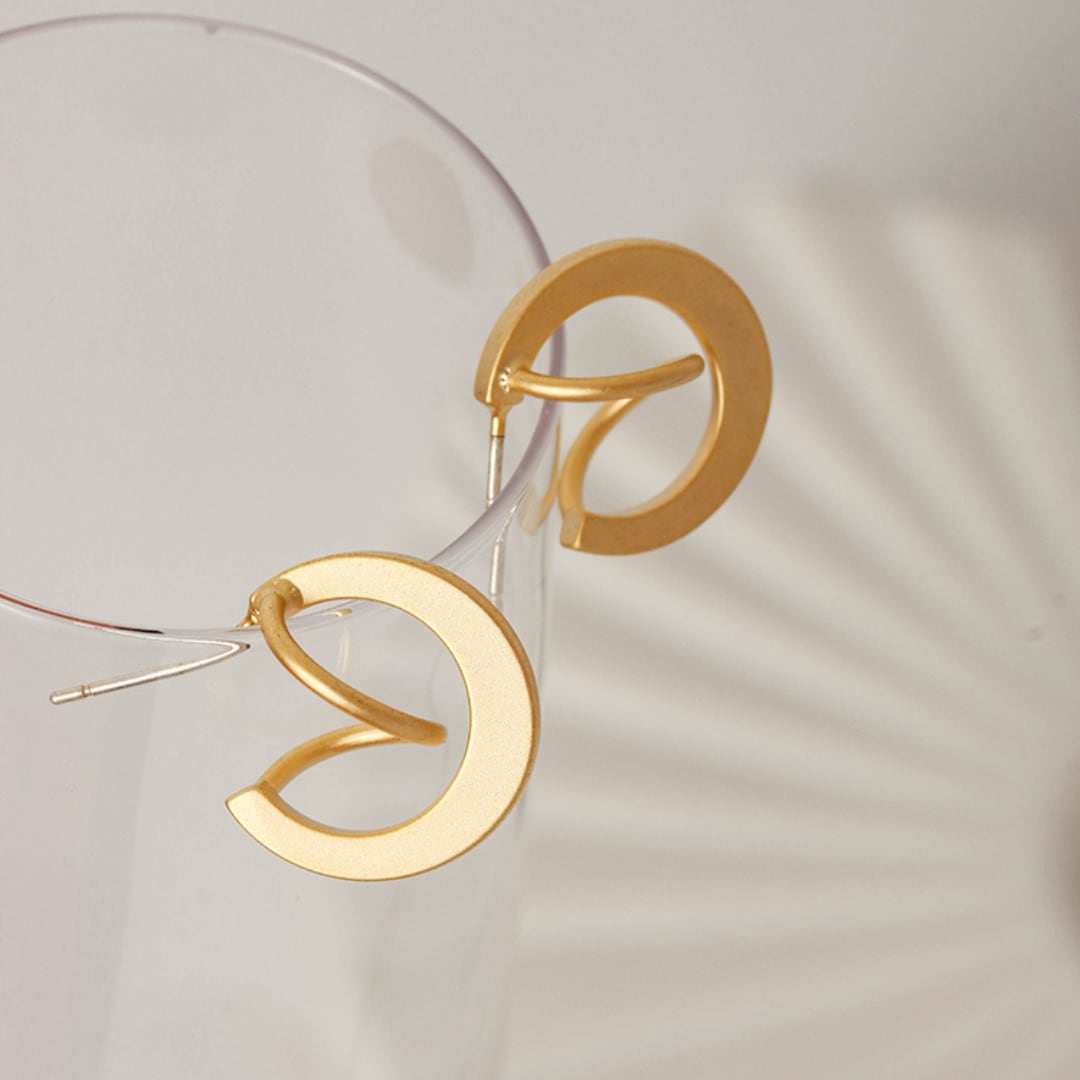 rotating planet matte metal geometric pierce