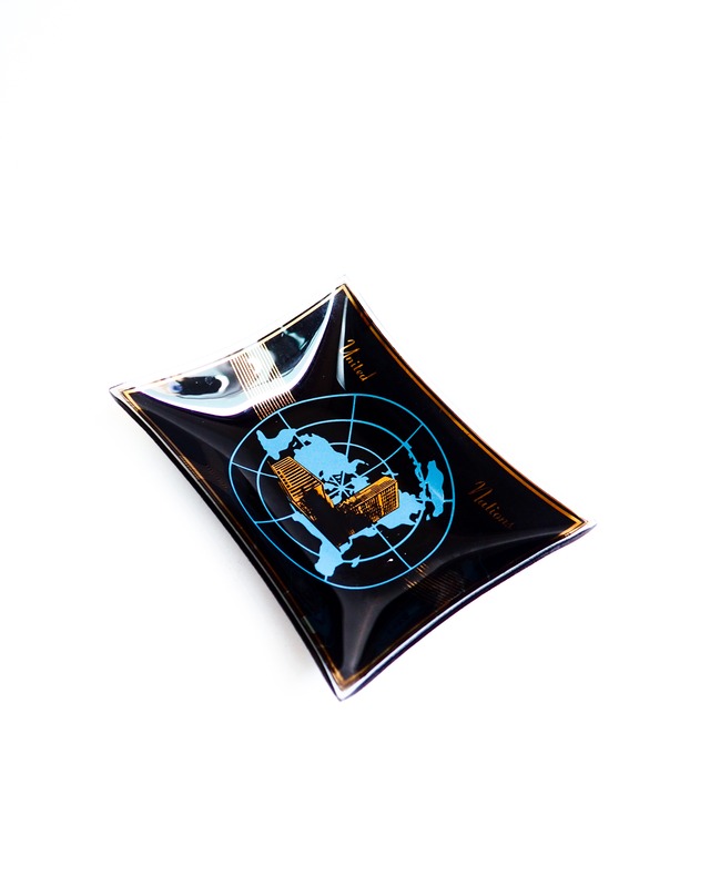 vintage tray from the United Nations made of smoky black glass tray