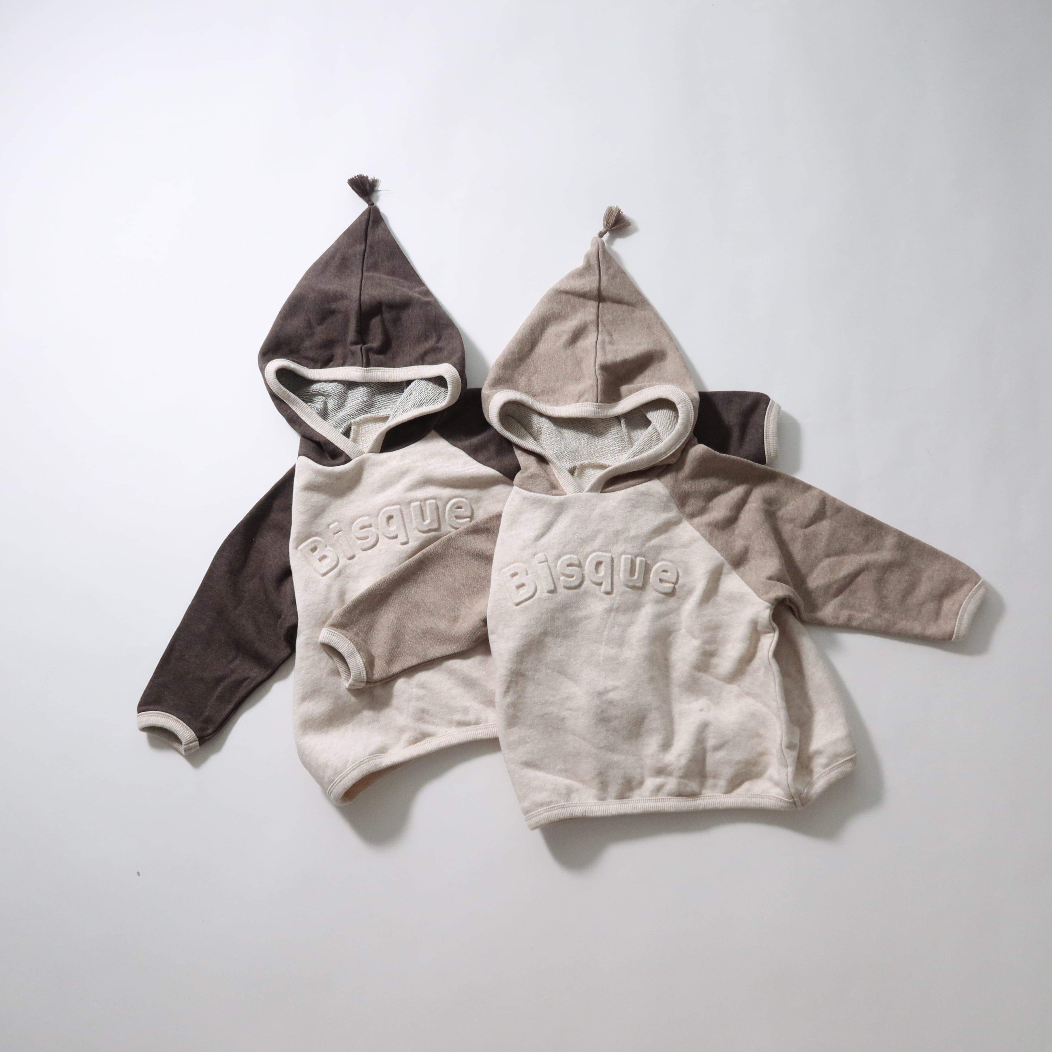 タッセルフードパーカー