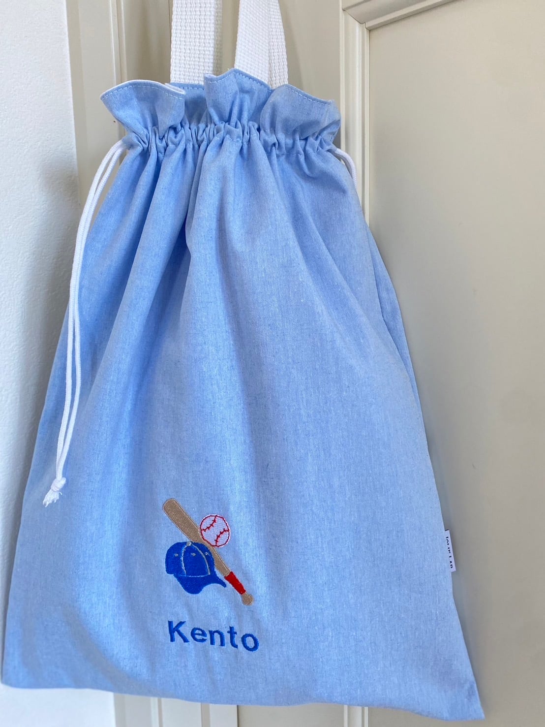 あおりポケットの巾着バッグ＊ミナペルホネン【1391】 【公式通販】