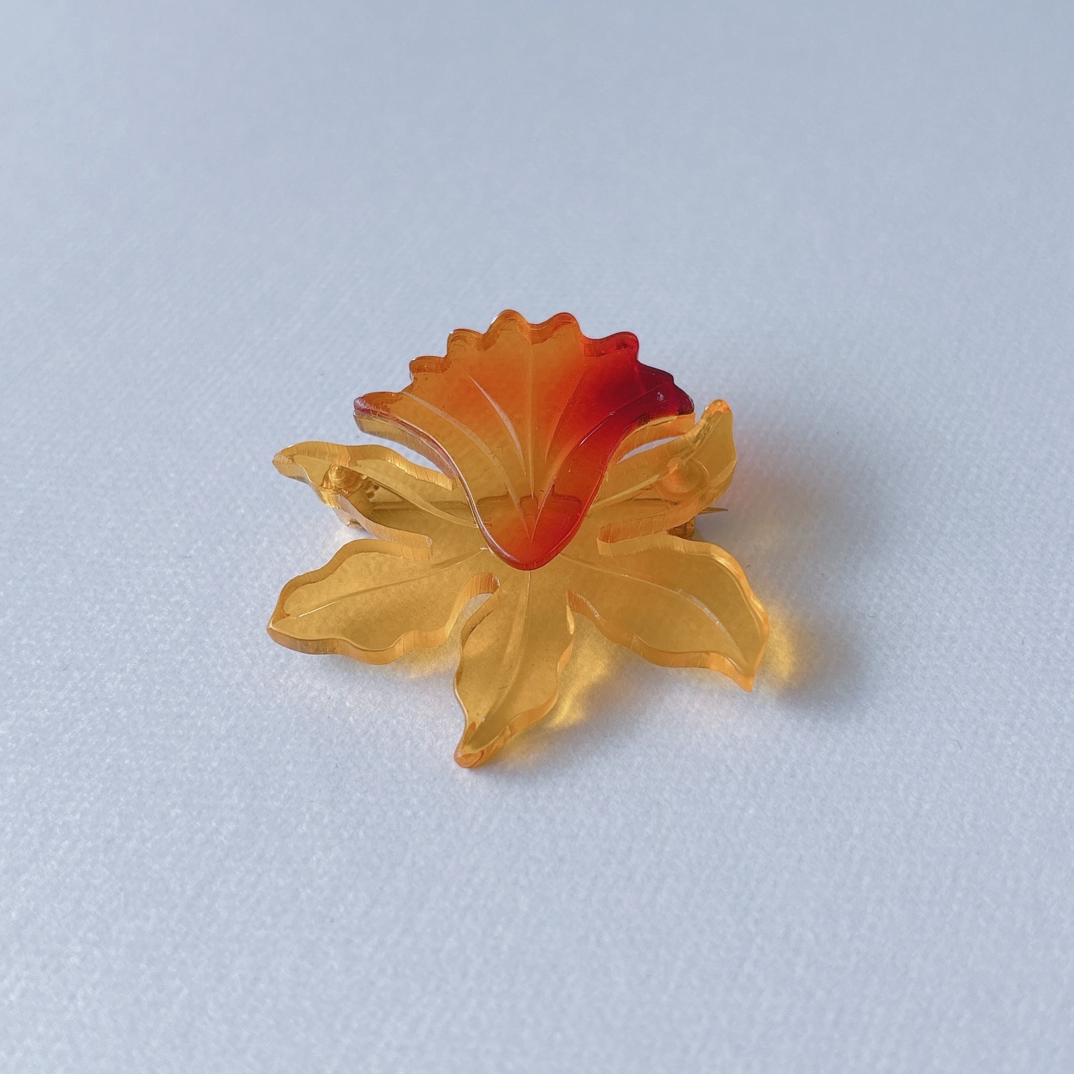 Vintage yellow orange amber acrylic plastic flower cattleya brooch