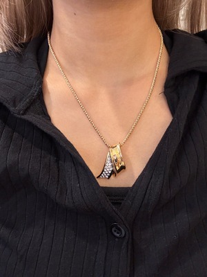 Yves Saint Laurent  / vintage ribbon motif stone gold necklace .