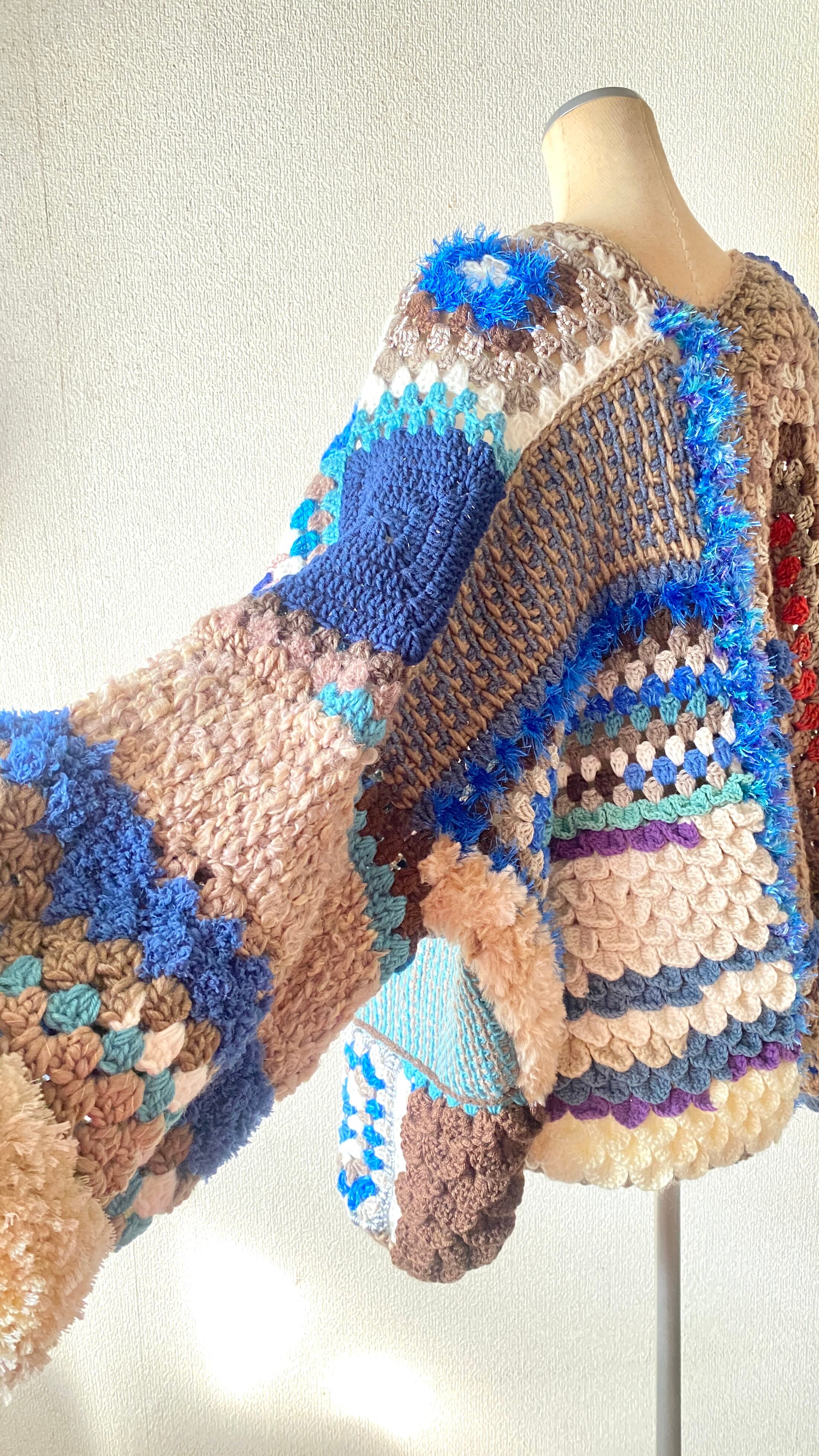 Crocheted granny hexagon and square motif asymmetrical cardigan