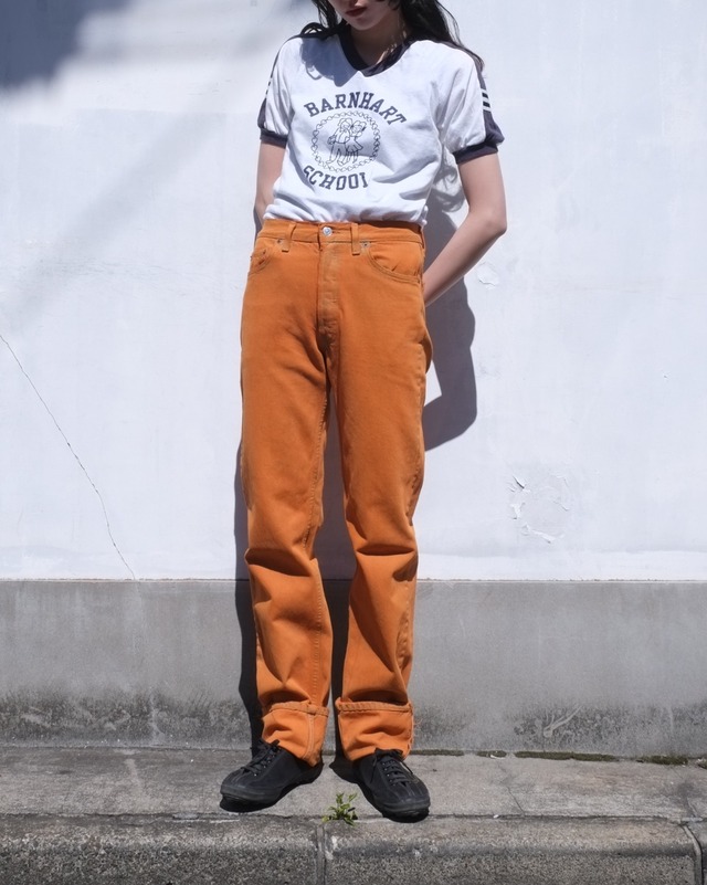 Levi's 501 orange denim pants.