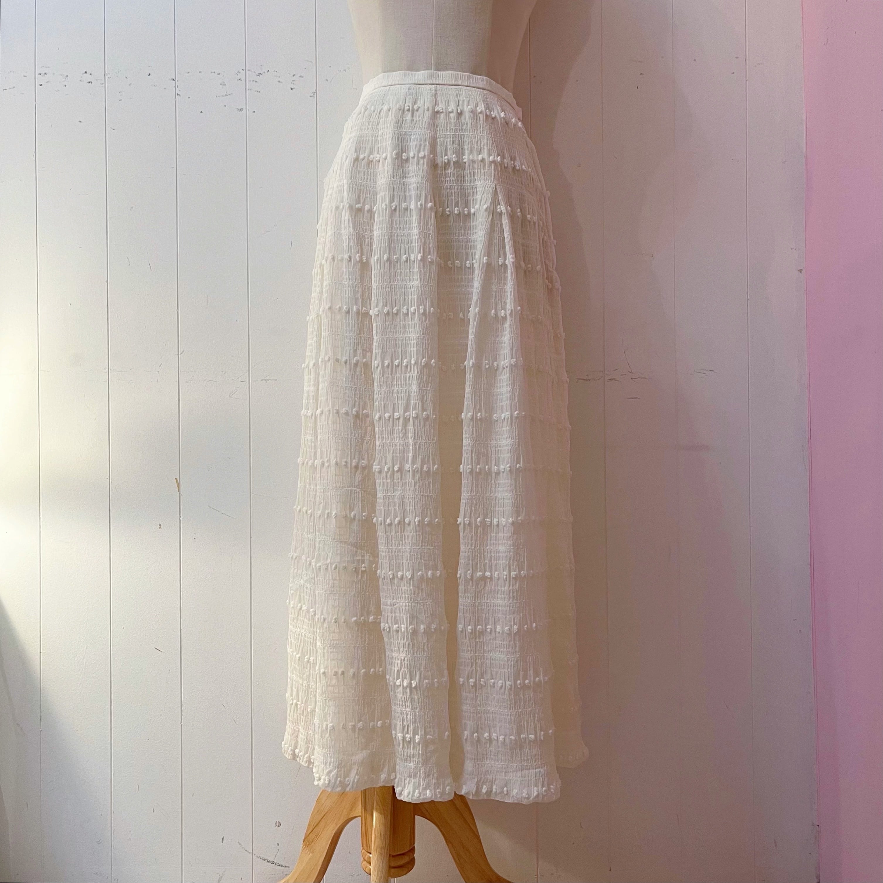 NINARICCI / mini ponpon white flare skirt