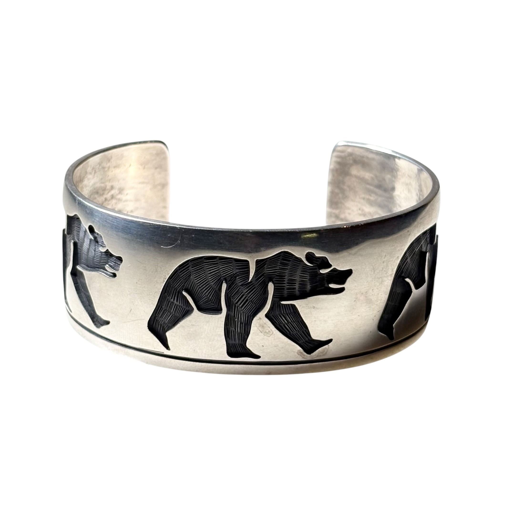 Hopi Lawrence Saufkie silver overlay bangle “walking bear” | NOIR