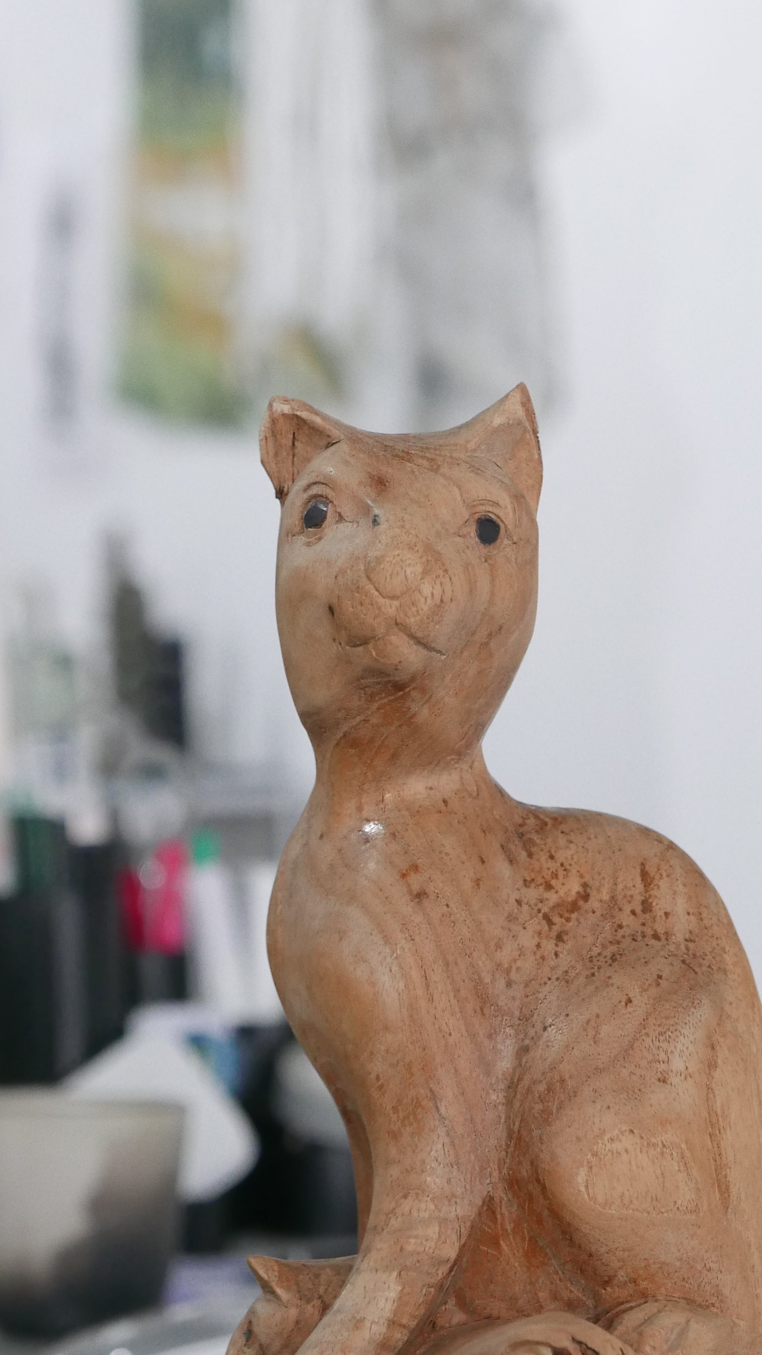 old wooden carving , family of cats