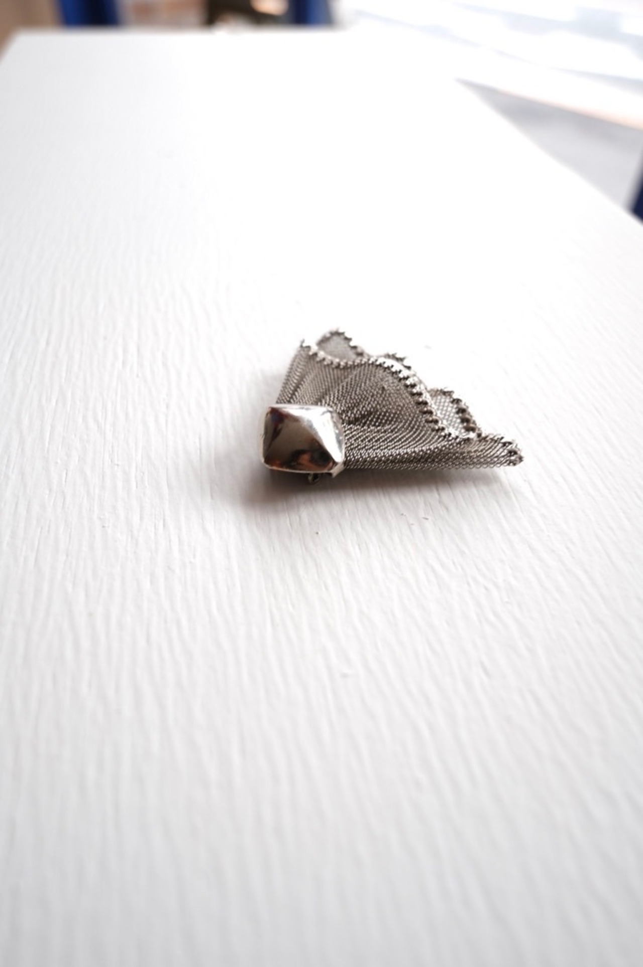 Silver frilled dress clip