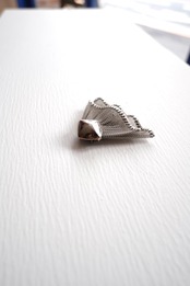 Silver frilled dress clip