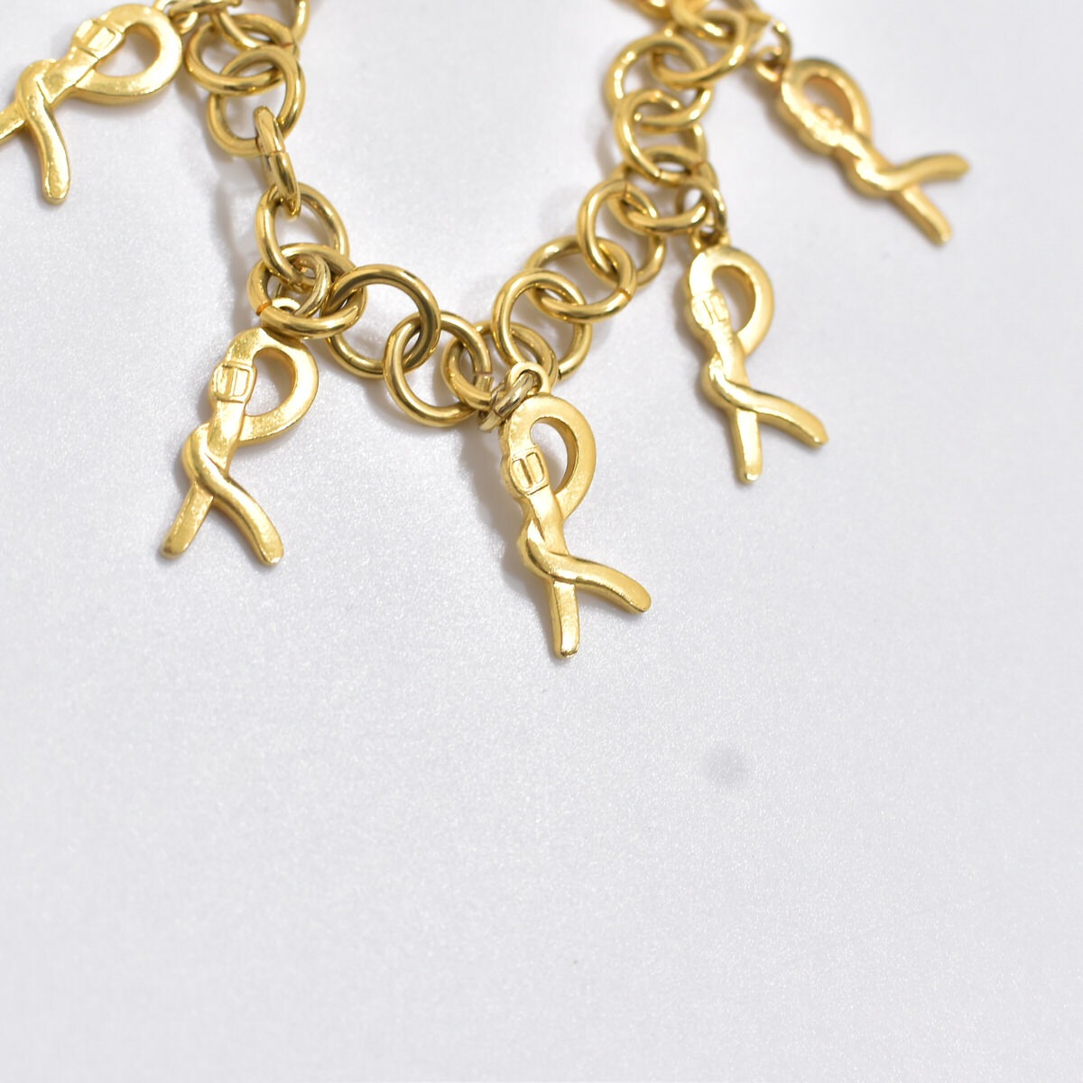 Vintage 50sファージングコイン チャーム付き チェーン ブレスレット Vintage チャーム付き ゴールドチェーン ブレスレット  アクセサリー ヴィンテージ 腕輪 ビンテージ ユニセックスデザイン | 古着屋 grin days memory 【公式】古着通販 オンラインストア