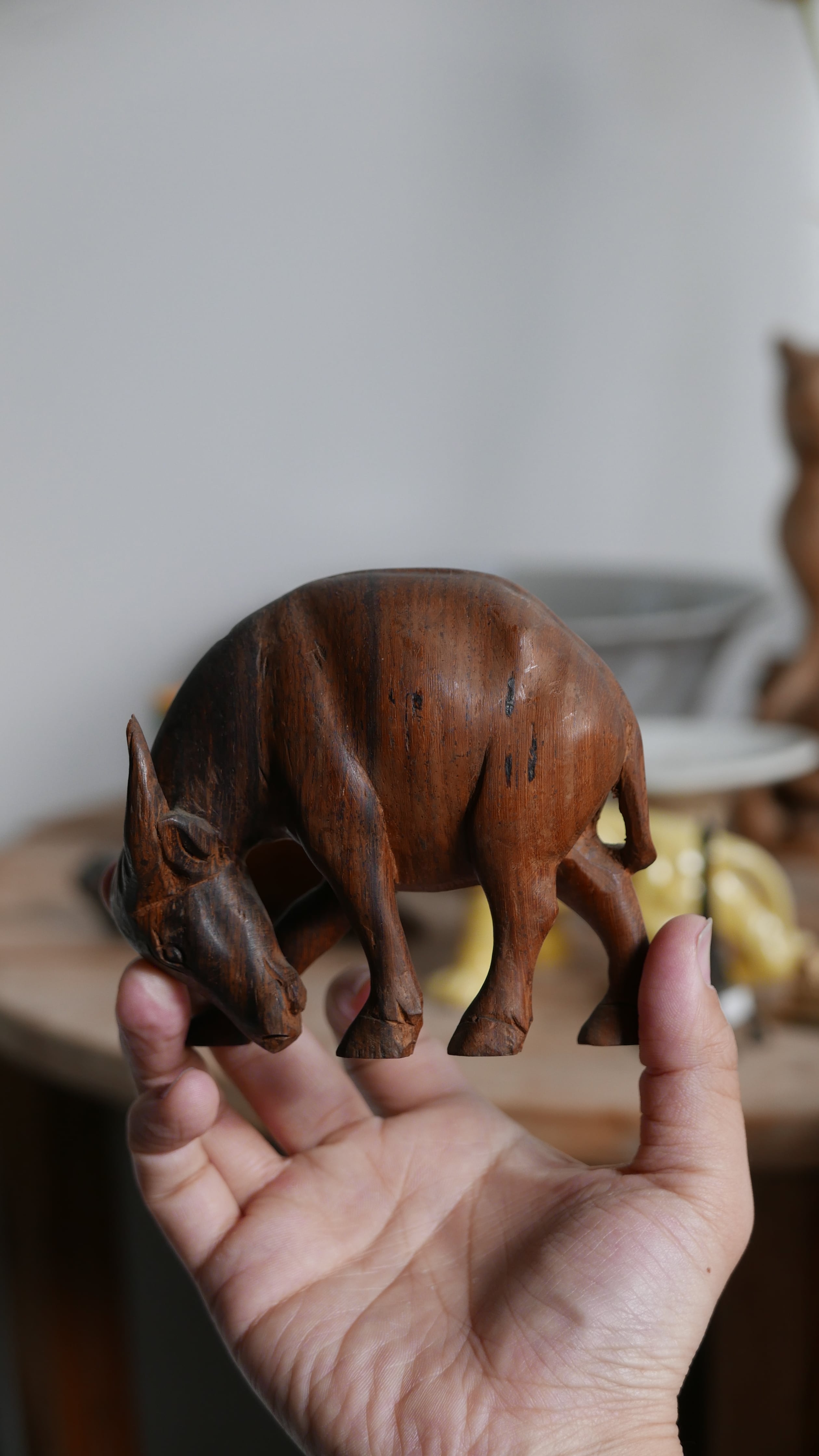 old wood carving , water buffalo , dark brown