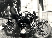 POLISE OFFCER ASTRIDE A HARLEY-DAVIDSON PHOTOGRAPH