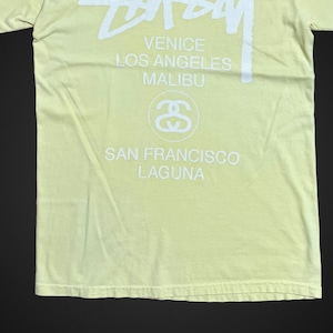 【STUSSY】ワールドツアー Tシャツ MEXICO製 バックプリント ロゴ クルーネック ショーンフォント ライトイエロー SSリンク シャネルロゴ ステューシー world tour tee 半袖 US古着