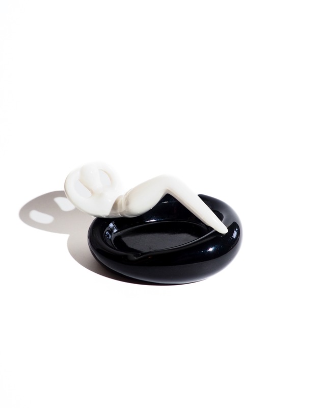 Ceramic ashtray with a person