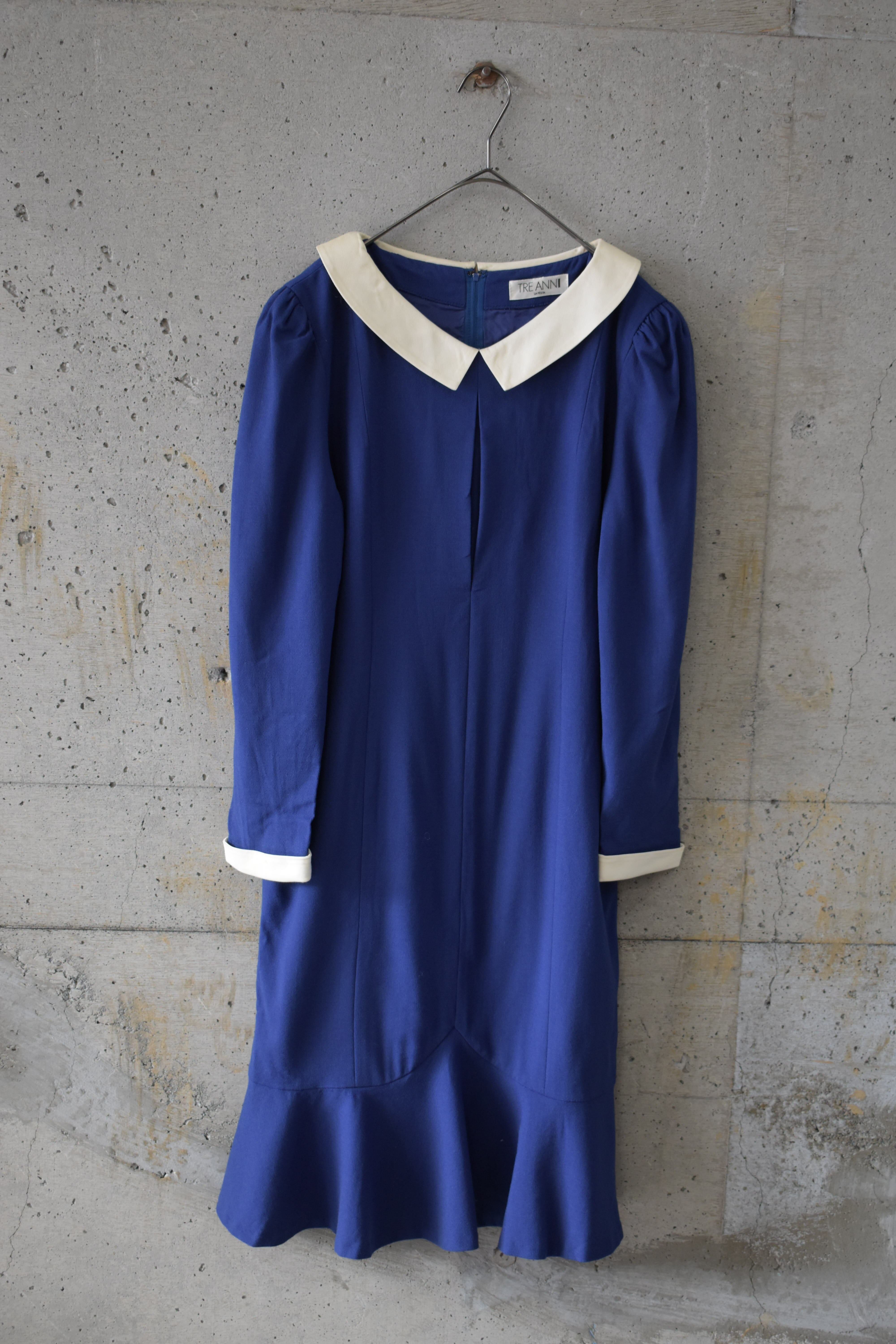 Blue dress with white collar and cuffs