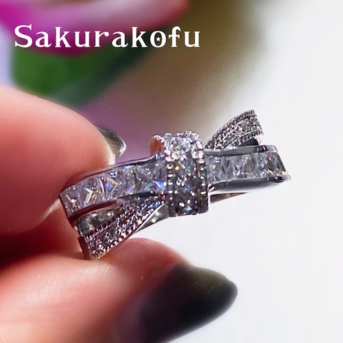 D035 Cross Ribbon  White Sapphire Ring