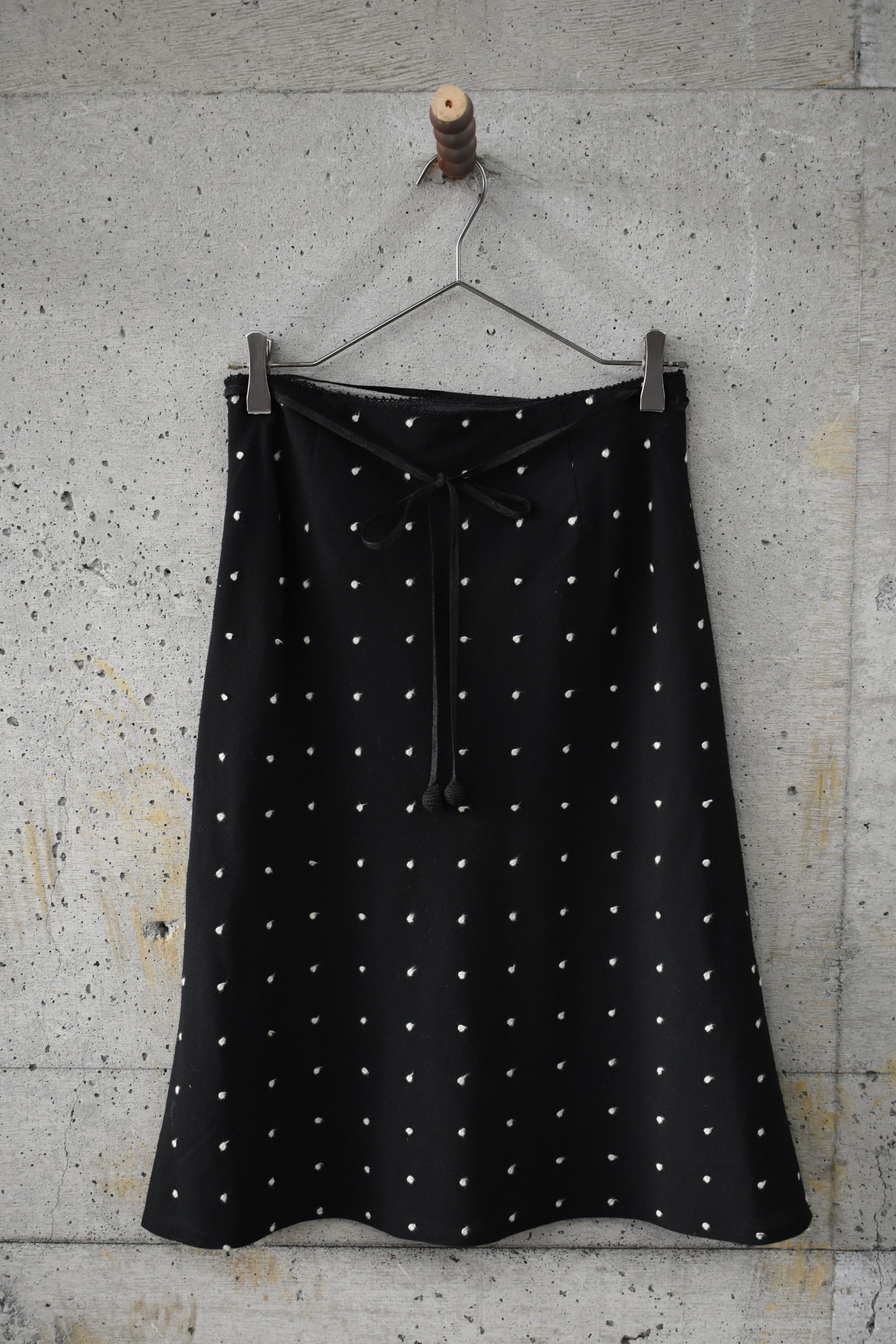 Textured black trapezoid skirt