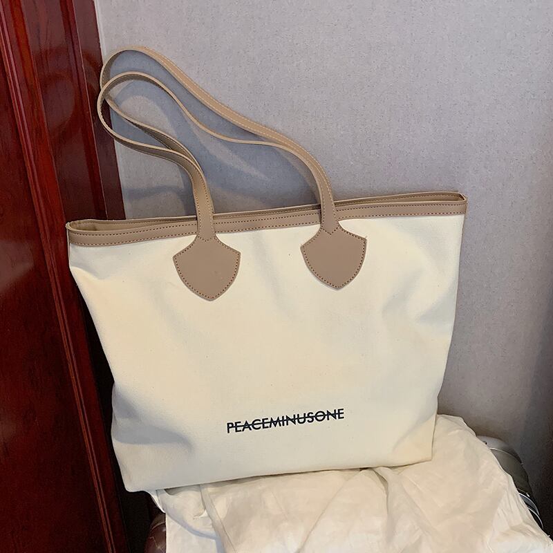 バッグ女性の大容量2020夏の新しいトレンディな野生のキャンバスショルダーバッグシンプルなファッションのポータブルトートバッグ Tiancai_Wing_Bag5465521
