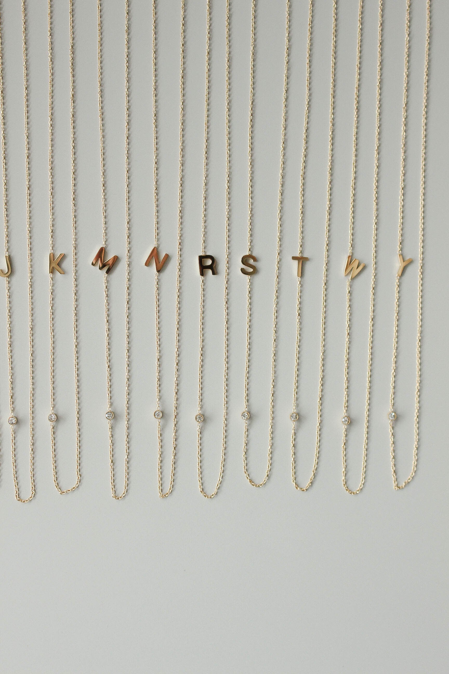 小物・アクセサリー E. Alphabet Zirconia Necklace / Gold | ebine(エビネ)|金属アレルギー