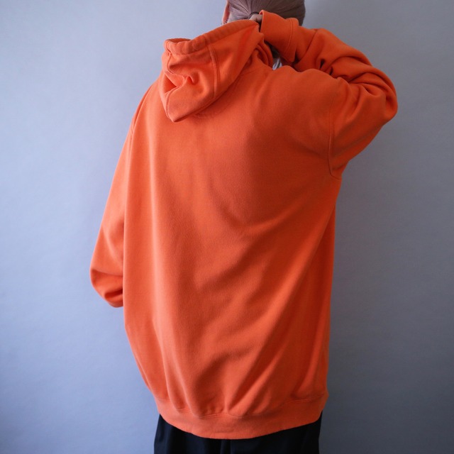 "Carhartt" sleeve logo printed over silhouette orange sweat parka