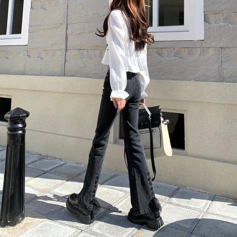 【新作】【送料無料】 香港スタイルのシックなスリットデニムの秋と冬の女性用のわずかにフレアなパンツは、トレンディなハイウエストのストレートレッグスリムでドレープのあるフロアレングスのパンツです。 0312010869991