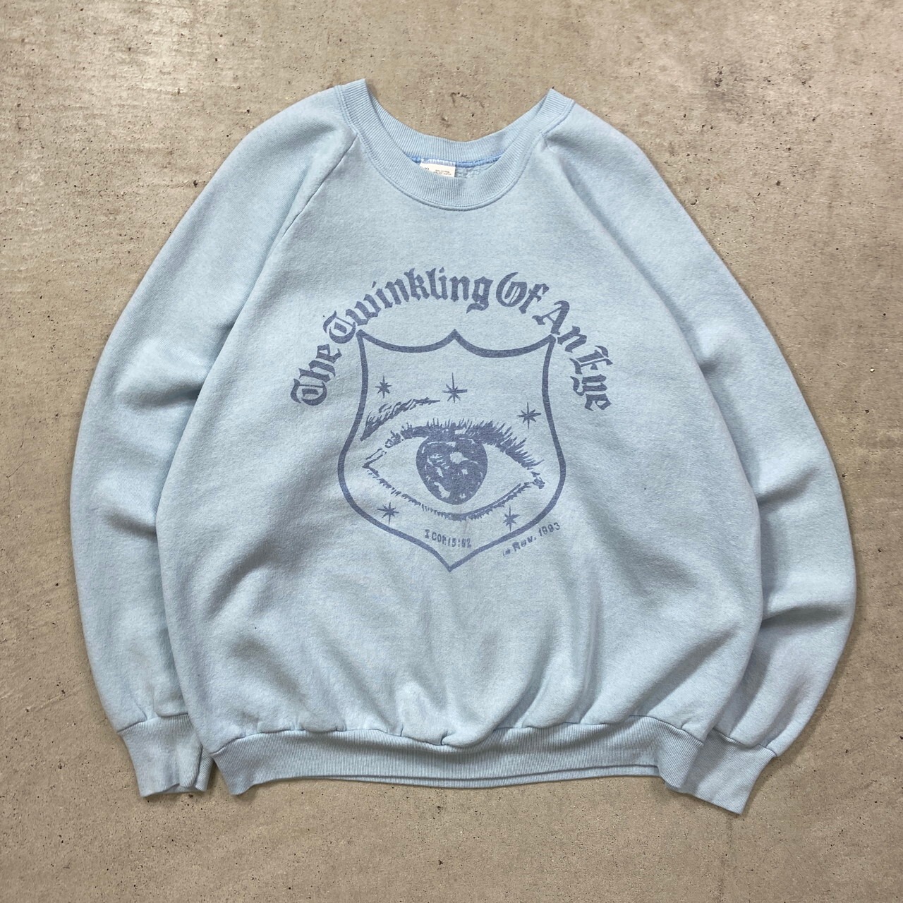 90年代 THE TWINKLING OF AN EYE ラグランスウェットシャツ 聖句 目 