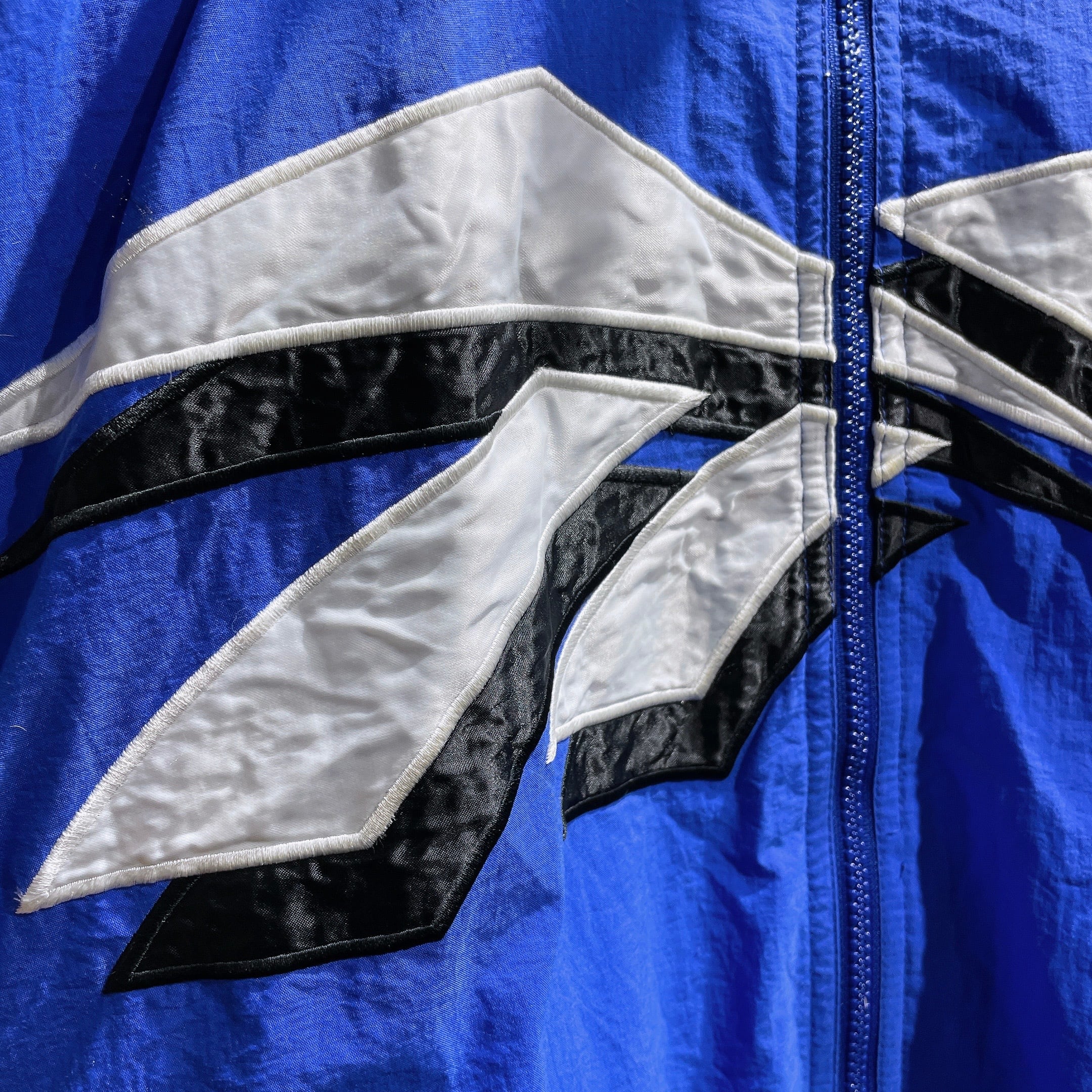1990s ” Old Reebok ” Big vector logo Embbossed vintage Track jacket