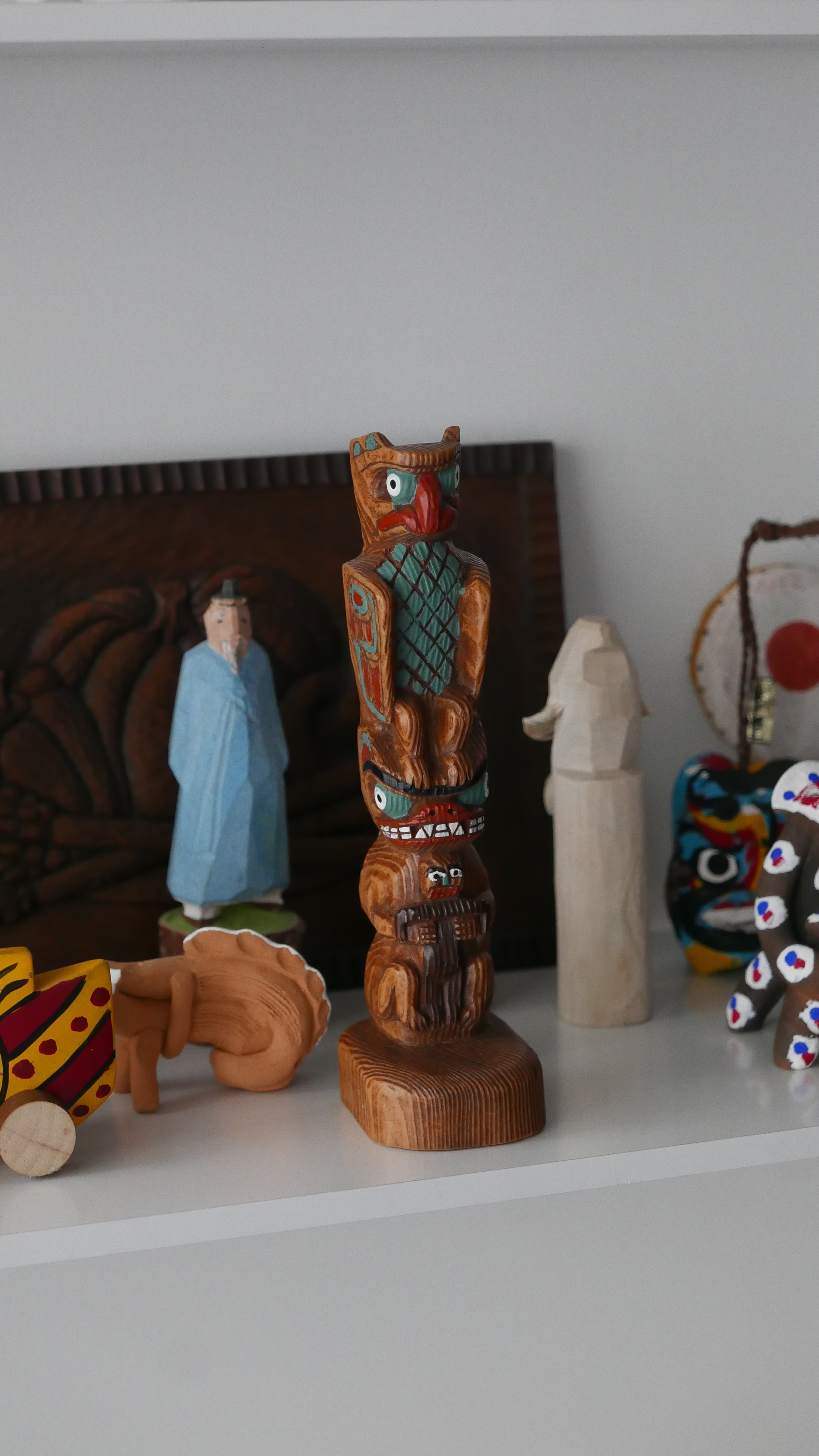 old totem pole , colorful / humorous