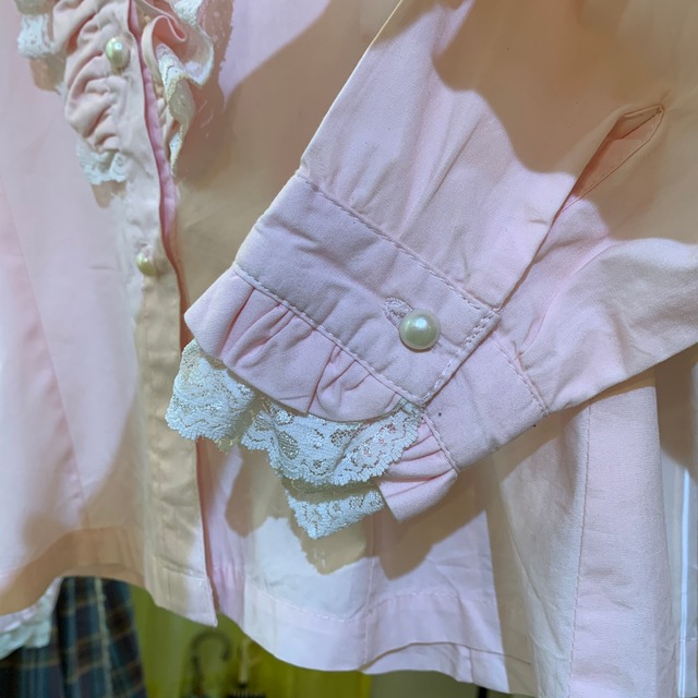 pink frill blouse with pearl buttons