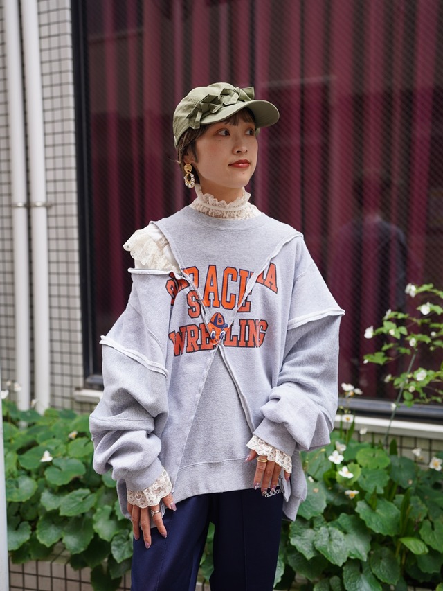 77circa (77サーカ) “circa make cross cutback wide print sweat top”