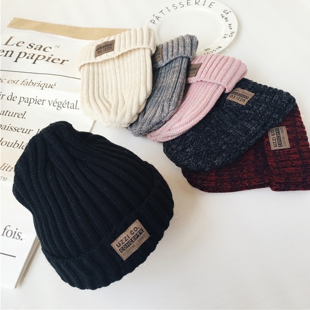 ウールの帽子の女性の秋と冬のラベリング混合色のニット帽のプルオーバーキャップ男性のファッション野生のカップルは暖かい潮を保ちます ブラック・アイド・ピーズ71303450111