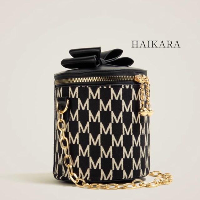 patterned cylindrical shoulder bag