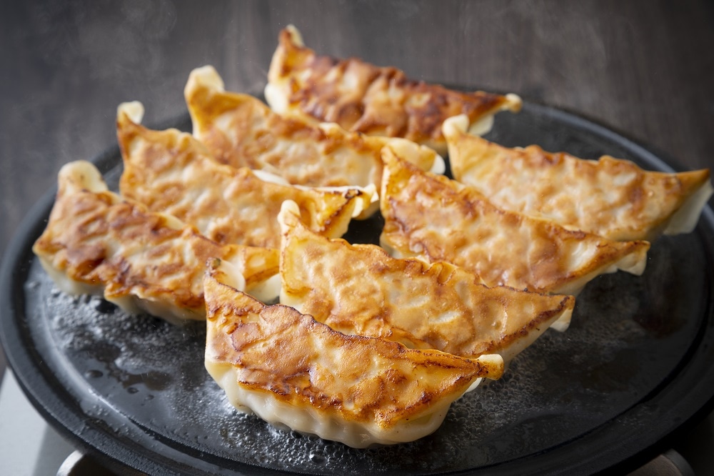 What is the main reason for being the number one gyoza consuming city in Japan for two consecutive years?
