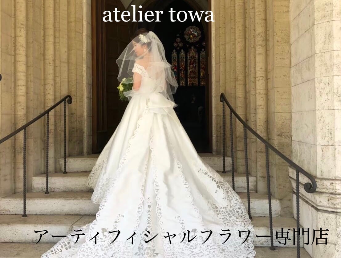 白木蓮と百合のクラッチブーケ ウェディングブーケ ブートニア 白木蓮と百合のクラッチブーケ ウェディングブーケ ブートニア
